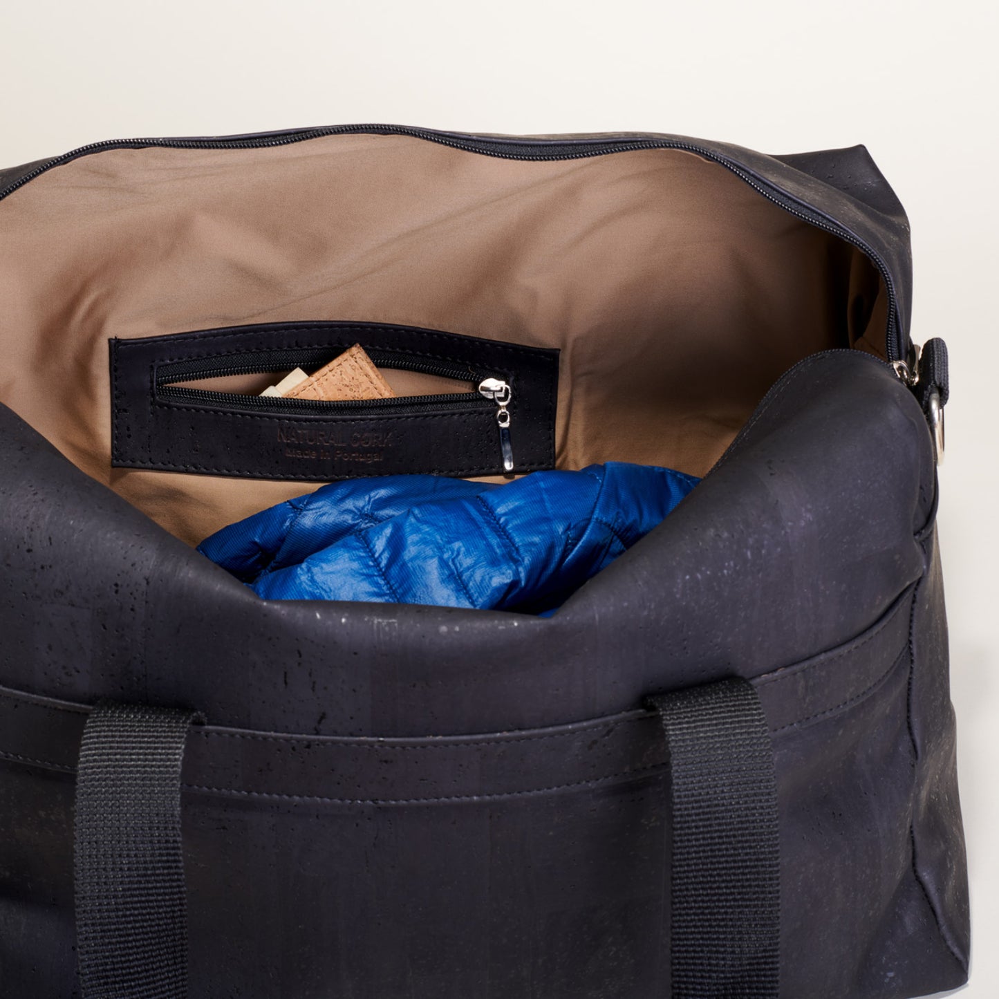 a person is sleeping in a suitcase