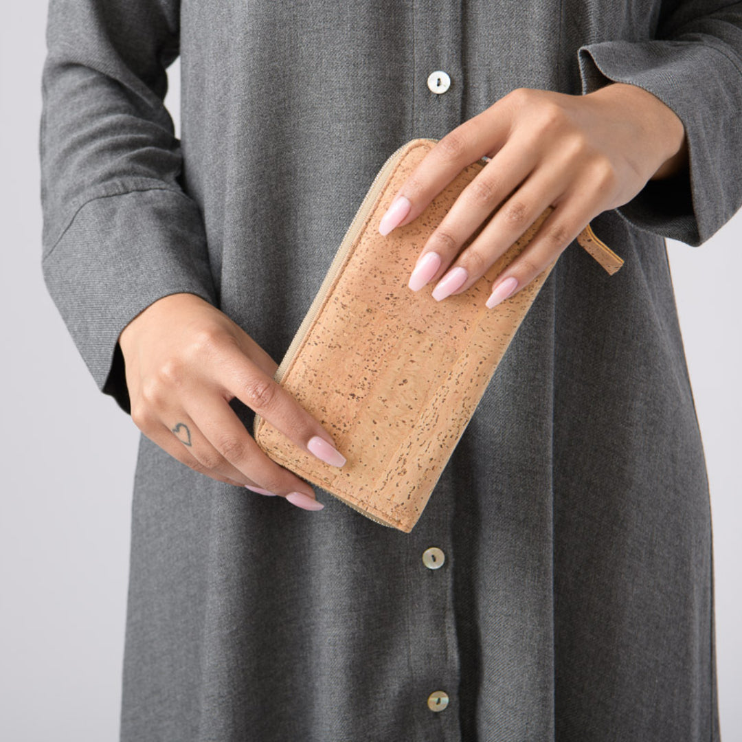 a man is holding a piece of luggage