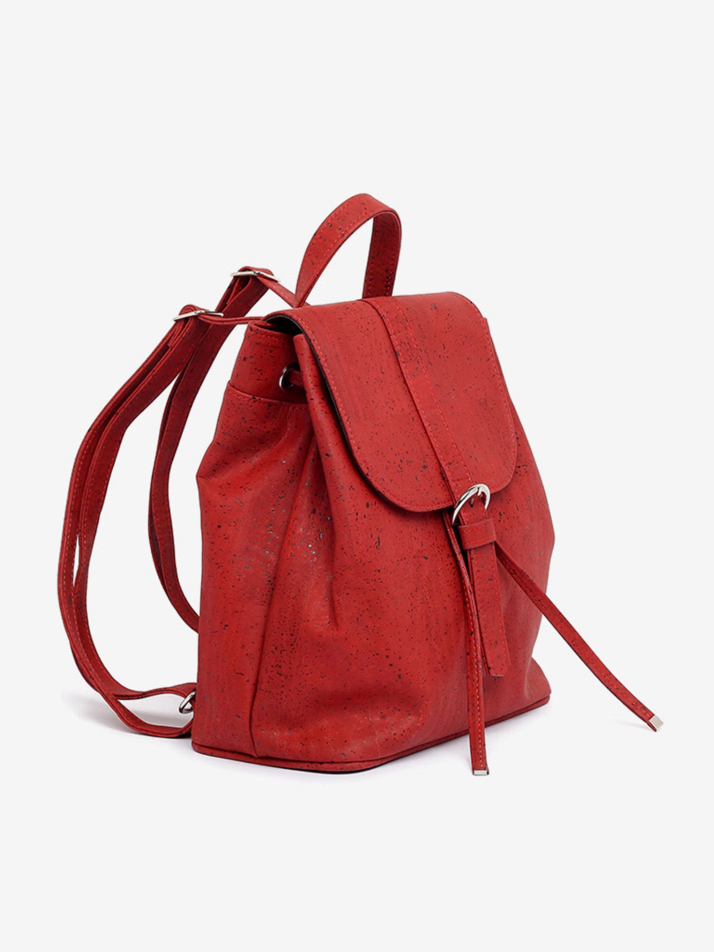 a red piece of luggage sitting on top of a white surface