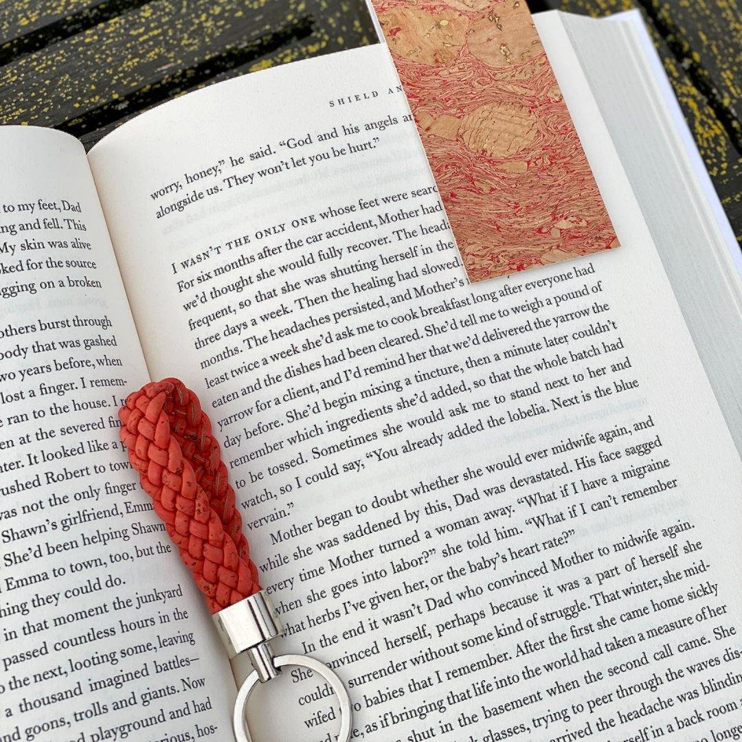 a pair of scissors sitting on top of a book 